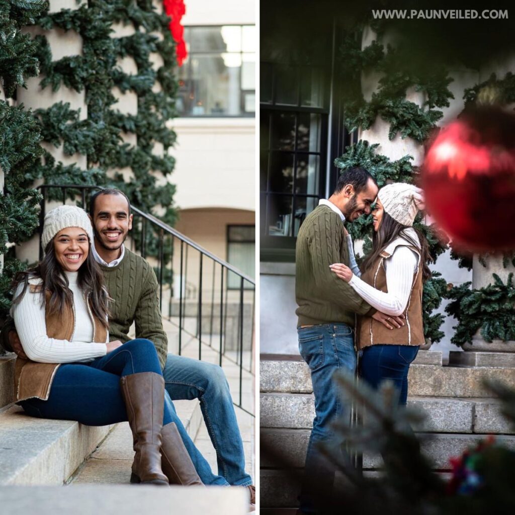 A couple sitting on the stairs outside posing with Christmas decorations