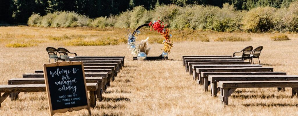 A wedding ceremony setup in a field