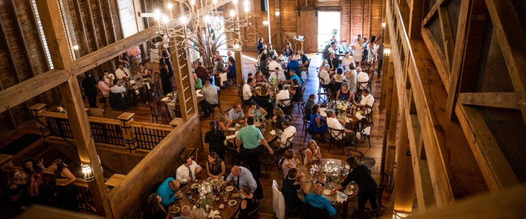 Wedding guests sitting down to eat dinner at the reception