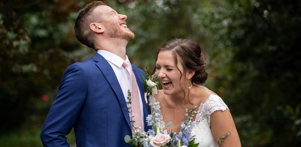 A bride and groom laughing