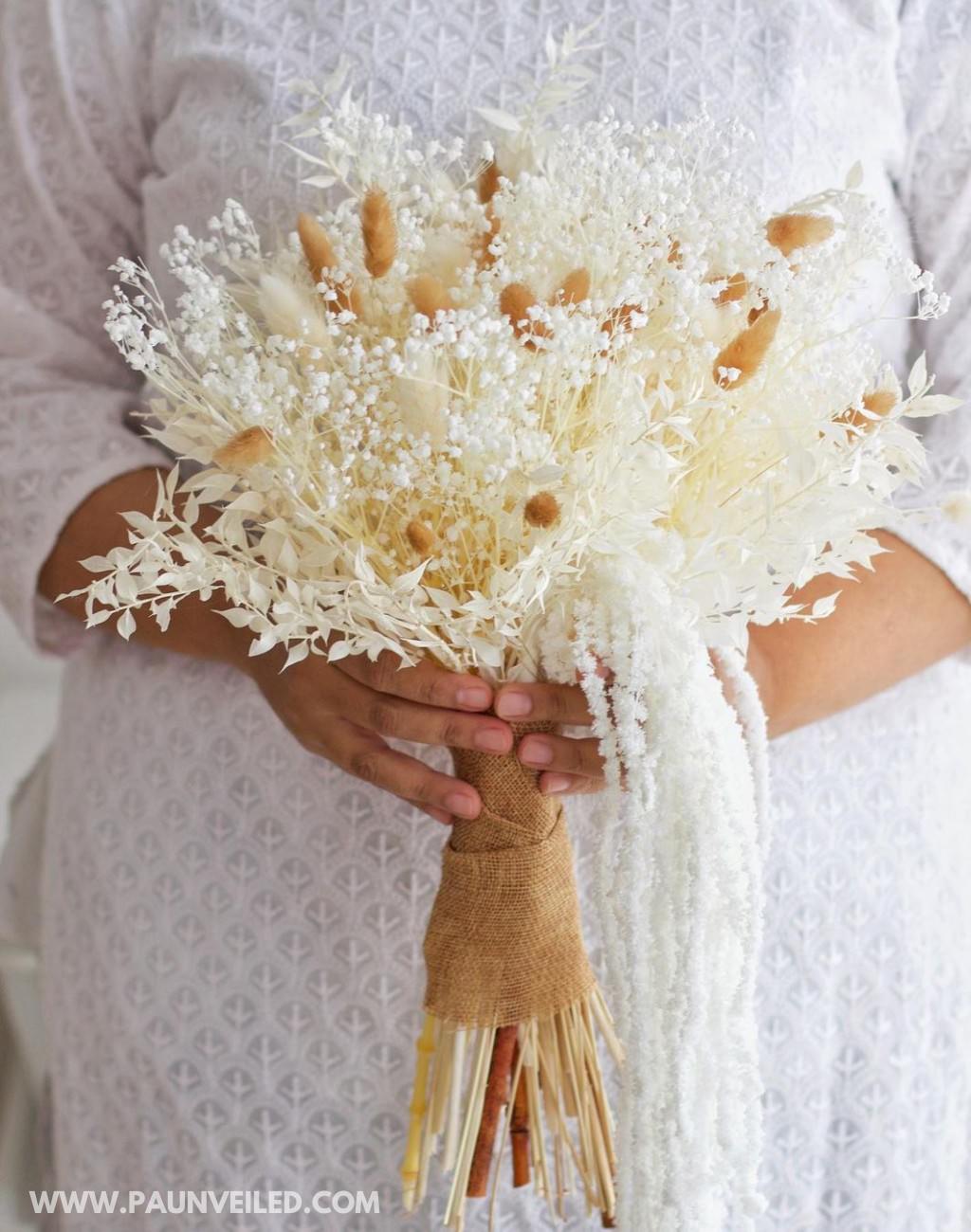 A light colored wedding bouquet for a rustic wedding