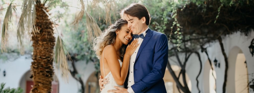 A bride and groom posing