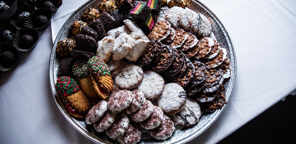 A wedding cookie table with an assortment of sweets