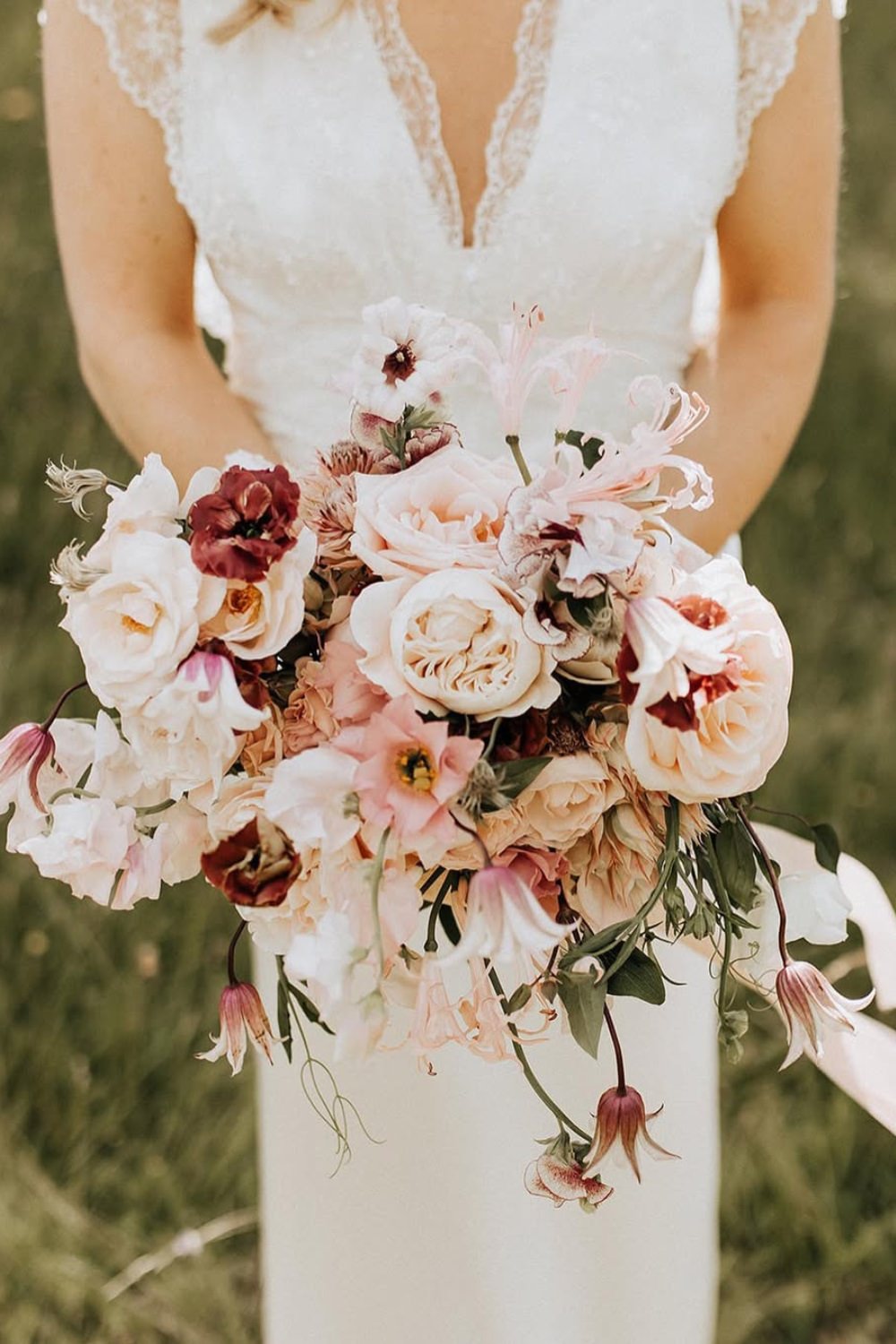 A light pink wedding bouquet with a loose hand-tied design